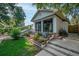 Charming home with lush landscaping and a welcoming entrance with steps at 4219 Magnolia Ave, Leesburg, FL 34748