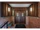 Inviting front entrance with double doors, decorative sidelights, and a 'hello' welcome mat at 4219 Magnolia Ave, Leesburg, FL 34748