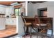 Kitchen with breakfast bar, stainless steel appliances, and tiled backsplash at 4219 Magnolia Ave, Leesburg, FL 34748