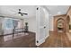 Bright home office with ceiling fan, desk, and decor with brick entryway and fountain at 4219 Magnolia Ave, Leesburg, FL 34748