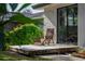 Relaxing outdoor deck with comfortable chair overlooking the backyard at 4219 Magnolia Ave, Leesburg, FL 34748