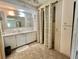 Bathroom featuring carpet flooring, a toilet, and vanity with marble countertop at 424 Hawthorne Blvd, Leesburg, FL 34748