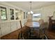 Dining area featuring built-in display cabinets and an elegant table setup at 424 Hawthorne Blvd, Leesburg, FL 34748