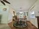 Cozy dining area with built-in cabinets and stylish chandelier for an intimate eating experience at 424 Hawthorne Blvd, Leesburg, FL 34748