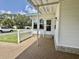 Cozy front porch with a stone patio area and vinyl siding, offering a relaxing outdoor space at 424 Hawthorne Blvd, Leesburg, FL 34748