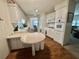 Well-lit kitchen with ample cabinet space, wood flooring, and a breakfast nook at 424 Hawthorne Blvd, Leesburg, FL 34748