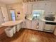 Functional kitchen with an eat-in countertop area and essential appliances at 424 Hawthorne Blvd, Leesburg, FL 34748