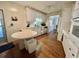 Bright kitchen with white cabinetry, wood flooring, and functional layout at 424 Hawthorne Blvd, Leesburg, FL 34748