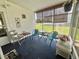 Relaxing lanai with ample seating space and a view of the surrounding neighborhood at 424 Hawthorne Blvd, Leesburg, FL 34748