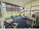 Enclosed lanai featuring furniture, floral decor and a view of the surrounding neighborhood at 424 Hawthorne Blvd, Leesburg, FL 34748