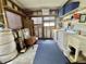 Efficient laundry space with washer, dryer, shelving, and ample storage solutions at 424 Hawthorne Blvd, Leesburg, FL 34748