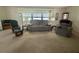 Bright and airy living room, with lots of natural light and a comfortable furniture arrangement at 424 Hawthorne Blvd, Leesburg, FL 34748