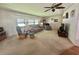 Inviting living room featuring a comfortable seating arrangement and bright natural light at 424 Hawthorne Blvd, Leesburg, FL 34748