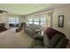 Spacious living room with views and comfortable seating, perfect for entertaining or relaxing at 424 Hawthorne Blvd, Leesburg, FL 34748