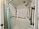 Walk in shower with seat, shelving, two shower heads and safety bars at 424 Hawthorne Blvd, Leesburg, FL 34748