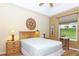 Cozy bedroom featuring ample natural light and neutral color palette, creating a relaxing retreat at 5008 Sawgrass Lake Cir, Leesburg, FL 34748