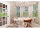 Bright breakfast nook with many windows and a view of the outside at 5008 Sawgrass Lake Cir, Leesburg, FL 34748