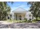Impressive community clubhouse with classic architecture and beautifully landscaped grounds at 5008 Sawgrass Lake Cir, Leesburg, FL 34748
