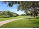 Scenic view of the community golf course with a well-manicured green at 5008 Sawgrass Lake Cir, Leesburg, FL 34748