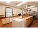Bright community kitchen with ample counter space, modern appliances, and plenty of cabinet storage at 5008 Sawgrass Lake Cir, Leesburg, FL 34748