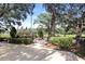 Peaceful community memorial park with flags and manicured gardens at 5008 Sawgrass Lake Cir, Leesburg, FL 34748