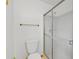 Bathroom features a toilet and glass enclosed standing shower with neutral wall color at 512 Galloway Ct, Leesburg, FL 34788