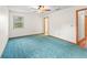 Cozy bedroom offers a window and ceiling fan at 512 Galloway Ct, Leesburg, FL 34788