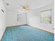 Spacious bedroom features neutral walls, two windows, and a ceiling fan at 512 Galloway Ct, Leesburg, FL 34788