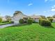 Charming single-story home with a well-manicured lawn and attached one car garage at 512 Galloway Ct, Leesburg, FL 34788