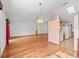 Spacious living room boasts wood floors and modern lighting at 512 Galloway Ct, Leesburg, FL 34788