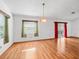 Open living room features natural light and a sliding door at 512 Galloway Ct, Leesburg, FL 34788