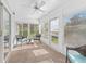 Bright sunroom featuring lots of windows and wicker furniture at 512 Galloway Ct, Leesburg, FL 34788