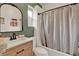 Well-lit bathroom with a stylish vanity, modern fixtures, and shower with white subway tiles at 520 Dora Ave, Tavares, FL 32778