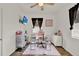 Bright bedroom area featuring a modern ceiling fan, tv, and well-lit desk, creating a perfect workspace at 520 Dora Ave, Tavares, FL 32778