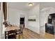 Dining area with a table and chairs, adjacent to the kitchen and living spaces at 520 Dora Ave, Tavares, FL 32778