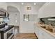 Clean kitchen with white cabinetry, stainless steel appliances, and wood-look flooring at 520 Dora Ave, Tavares, FL 32778