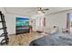 Bright bedroom featuring wood-look flooring, natural light, and ample closet space at 520 Dora Ave, Tavares, FL 32778