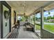 Inviting screened porch with seating area, offering a relaxing outdoor space at 520 Dora Ave, Tavares, FL 32778
