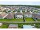 Aerial view of a backyard with large grassy lawn at 5386 Pine Lilly Dr, St Cloud, FL 34771
