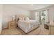 Bright bedroom with a neutral color scheme, a plush bed, and coordinated side tables at 5386 Pine Lilly Dr, St Cloud, FL 34771