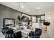 Open-concept dining area adjoining a stylish kitchen with white cabinetry at 5386 Pine Lilly Dr, St Cloud, FL 34771