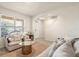 Inviting living room featuring neutral decor, plush seating, and an entryway at 5386 Pine Lilly Dr, St Cloud, FL 34771