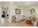 Cozy living area featuring plush seating, decorative mirror, and stylish accents at 5386 Pine Lilly Dr, St Cloud, FL 34771