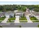 Aerial street view of homes features well-manicured lawns and mature trees at 5386 Pine Lilly Dr, St Cloud, FL 34771
