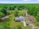 Aerial view of home and surrounding wooded lot at 5390 Nw 12Th Pl, Ocala, FL 34482