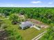 Aerial view of home and surrounding wooded area at 5390 Nw 12Th Pl, Ocala, FL 34482
