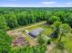 Aerial view of single-story home on wooded lot at 5390 Nw 12Th Pl, Ocala, FL 34482