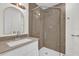 Bathroom features a modern vanity with glass enclosed shower at 5390 Nw 12Th Pl, Ocala, FL 34482