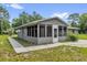 Single-story home showing enclosed sunroom at 5390 Nw 12Th Pl, Ocala, FL 34482