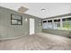 Enclosed sunroom featuring door, window, and natural light at 5390 Nw 12Th Pl, Ocala, FL 34482